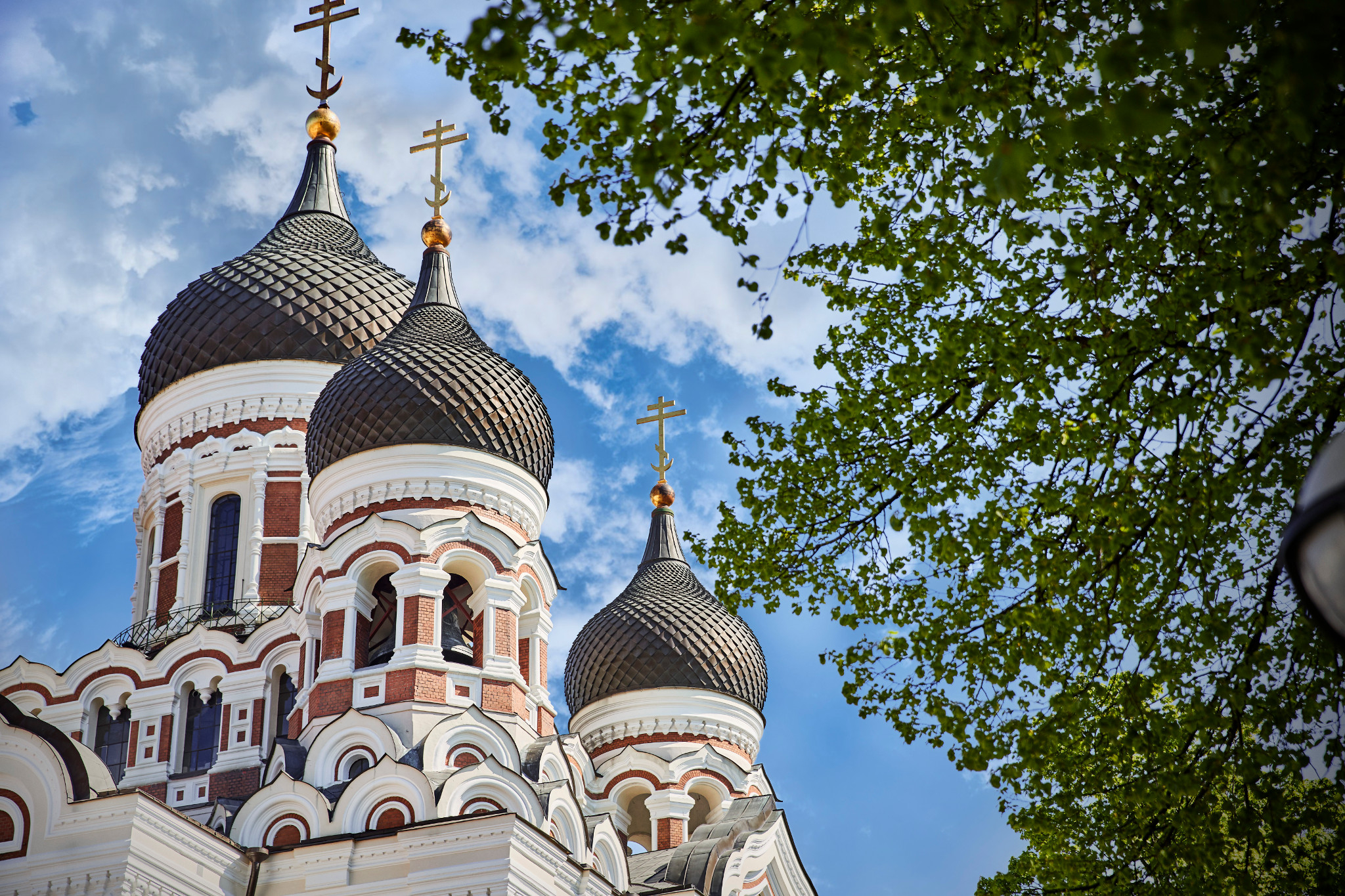 Looking up at the Alexander Nevsky Cathedral, with the blue sky as a backdrop.